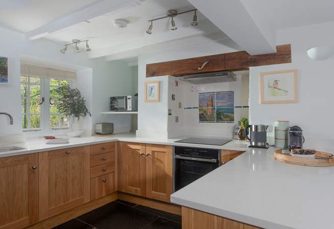 The family kitchen is well-equipped and even has a coffee pod machine. 