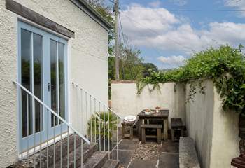 Long sunny evening meals to be had in this sheltered spot, tucked away next to the games-room.