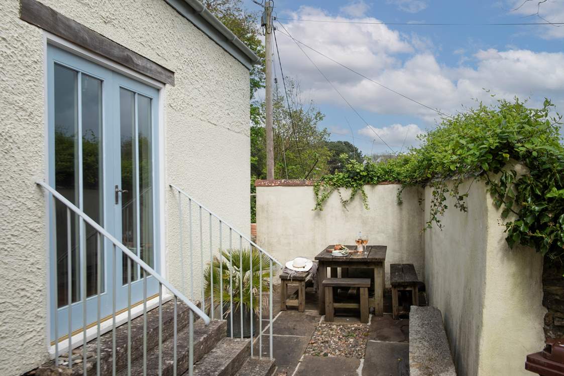 Long sunny evening meals to be had in this sheltered spot, tucked away next to the games-room.