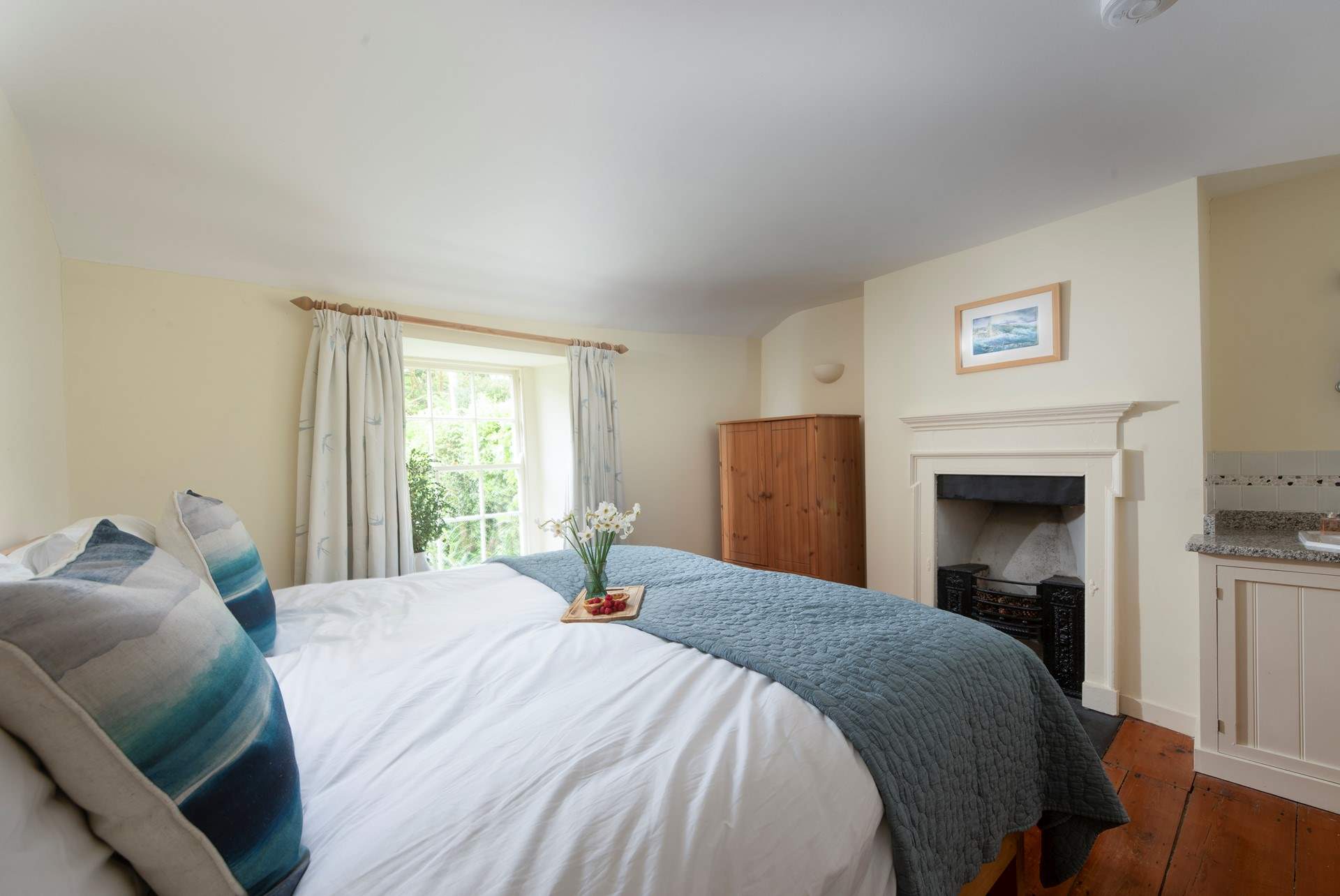 This bedroom has a huge super-king bed which can also be turned into twins, and a handy sink too.