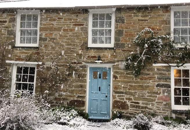 Grove Cottage is as pretty as a picture in the snow. 
