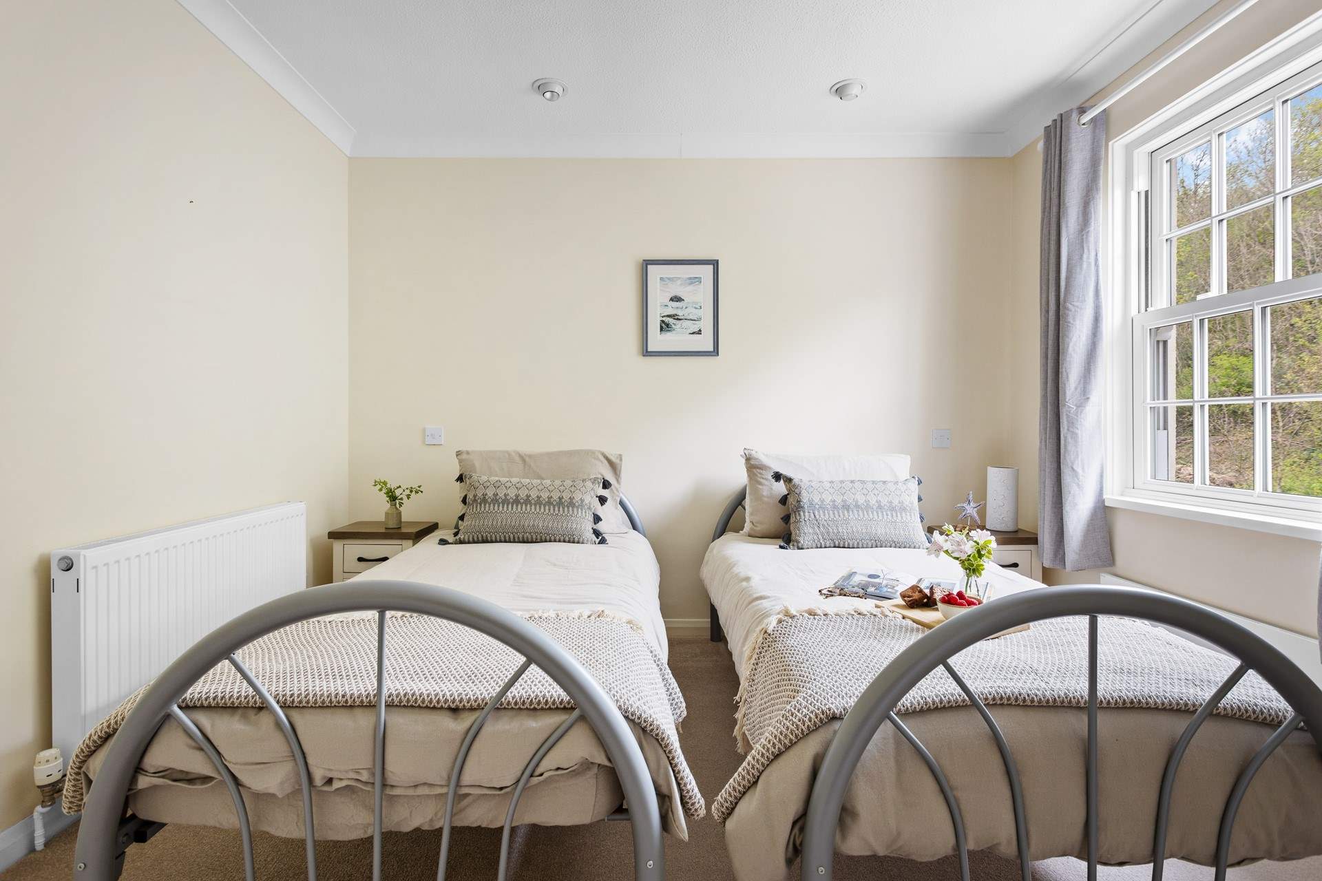 Charming twin beds in bedroom 2.