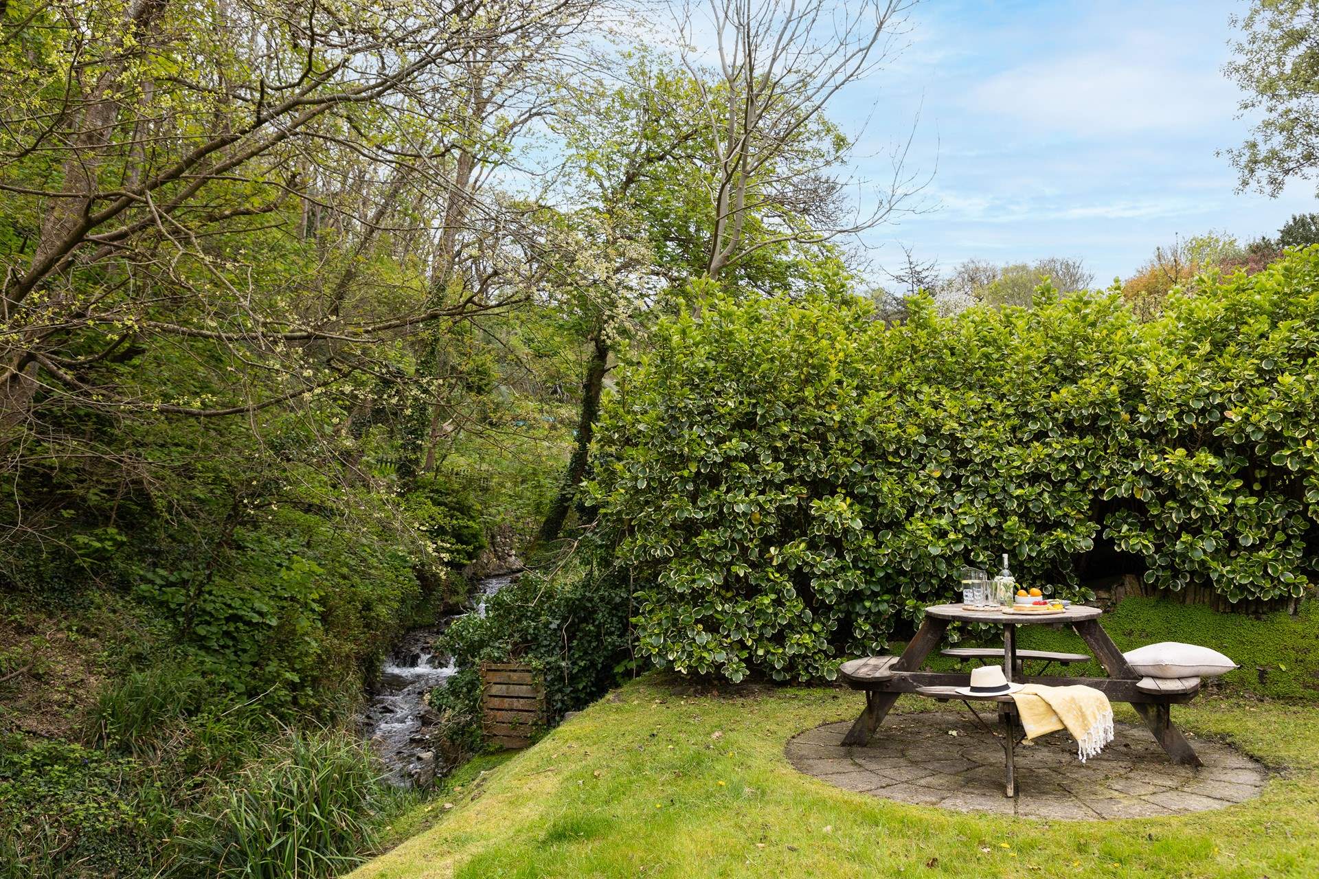 The river Jordan provides a natural boundary at the bottom of the garden.