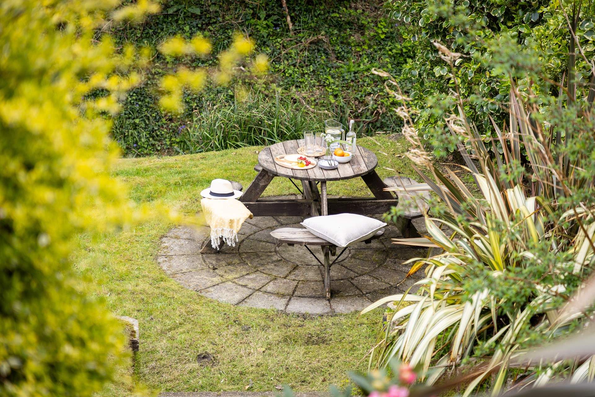 Enjoy meals in the sunny garden with the cascading waters of the stream as your backdrop.