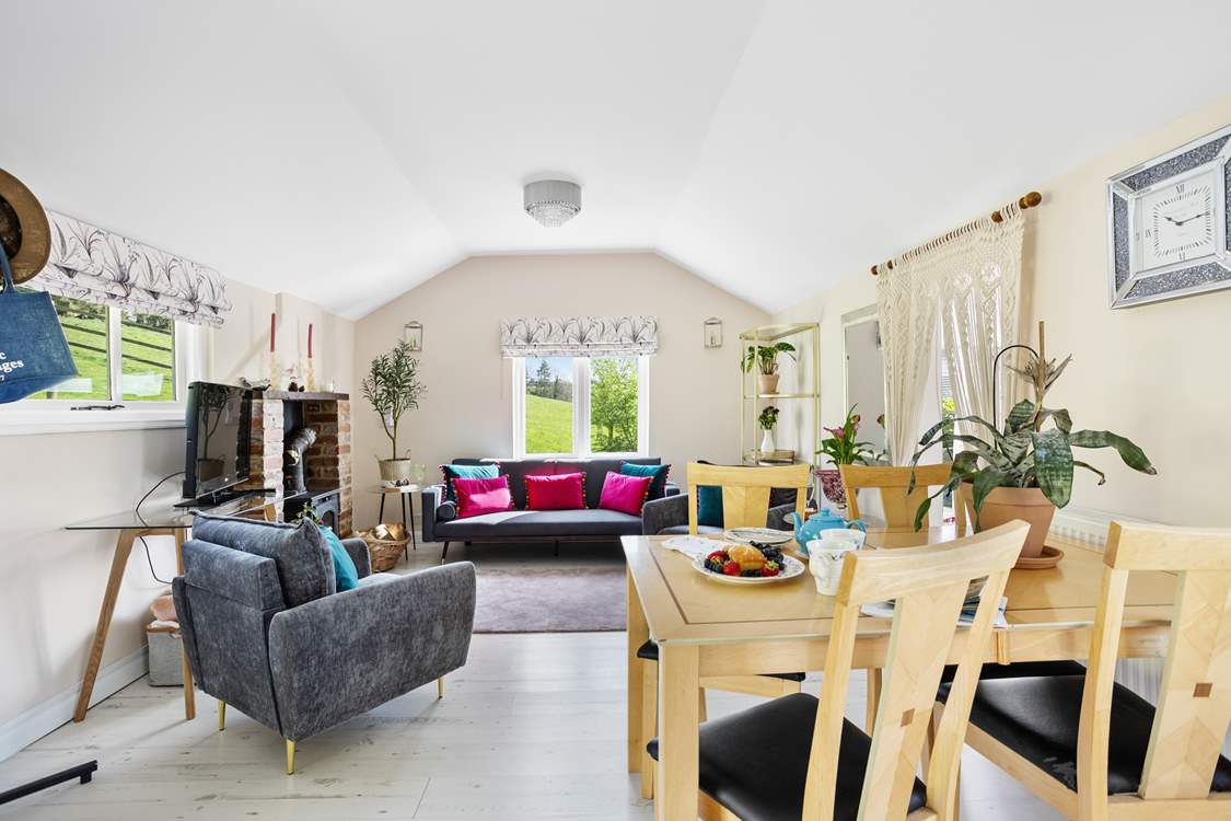 The bedroom is accessed through the curtains and down two steps.