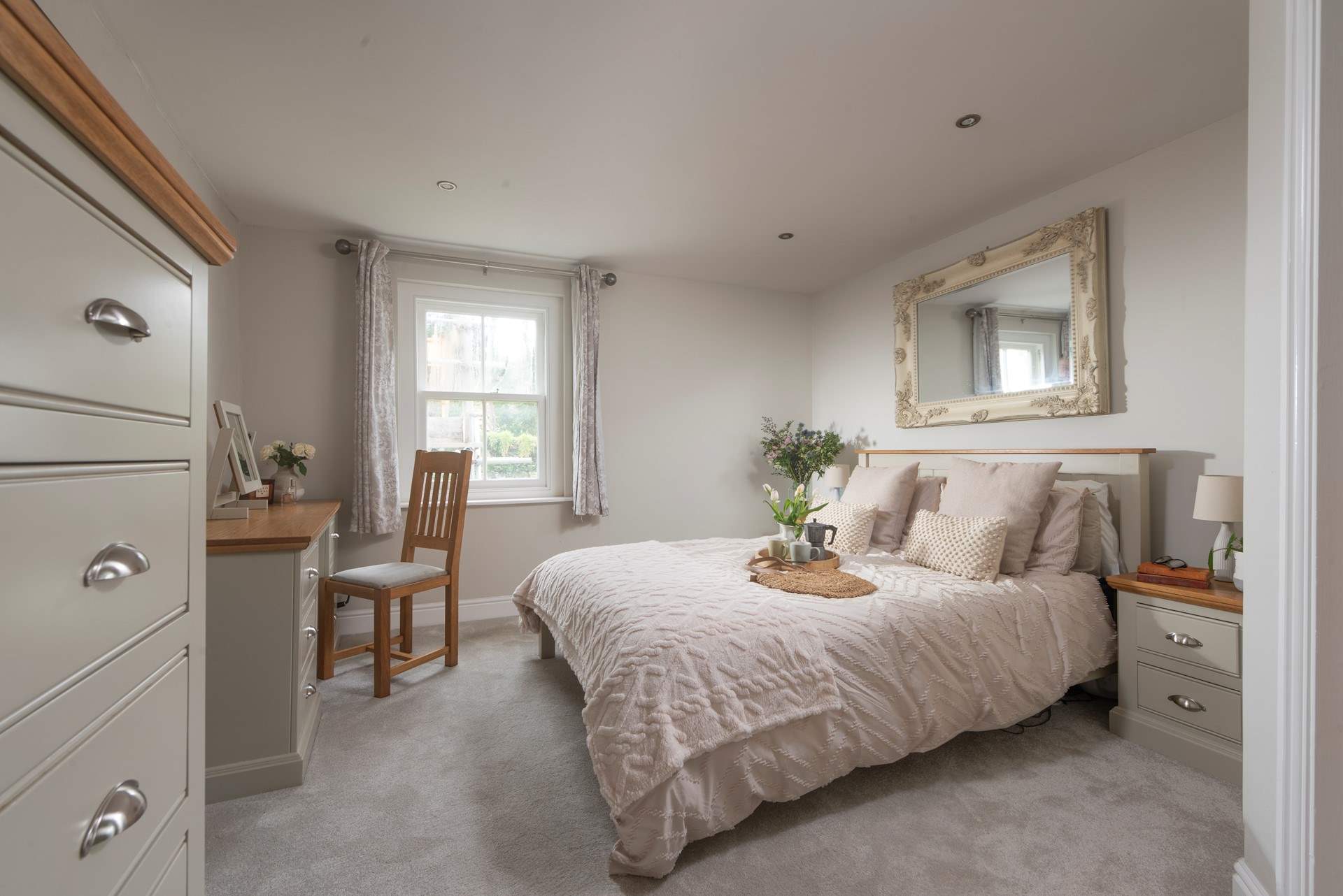 This bedroom on the first floor has a sumptuous king-size bed and an en suite shower-room.