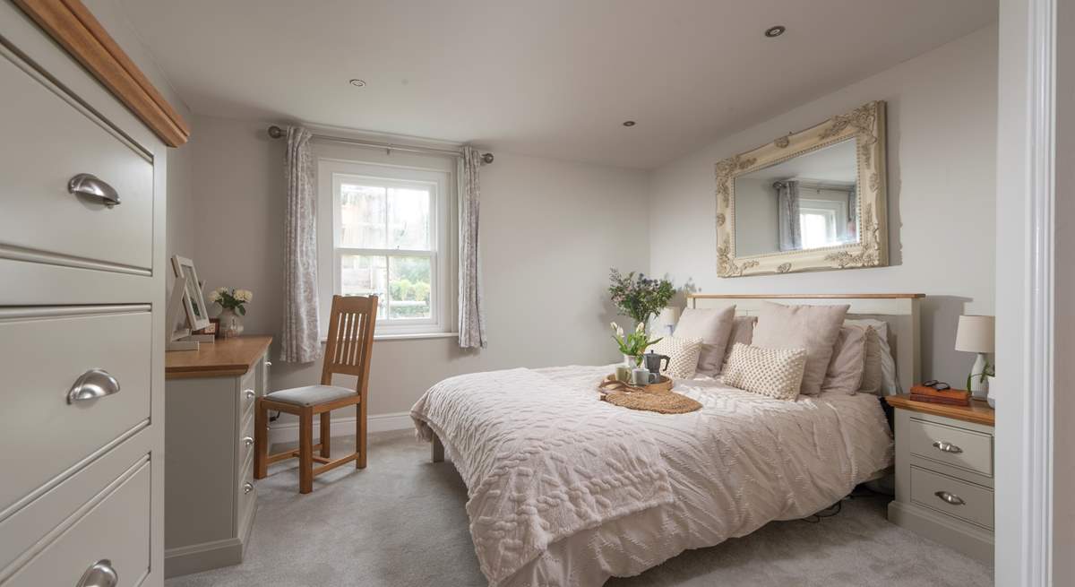 This bedroom on the first floor has a sumptuous king-size bed and an en suite shower-room.