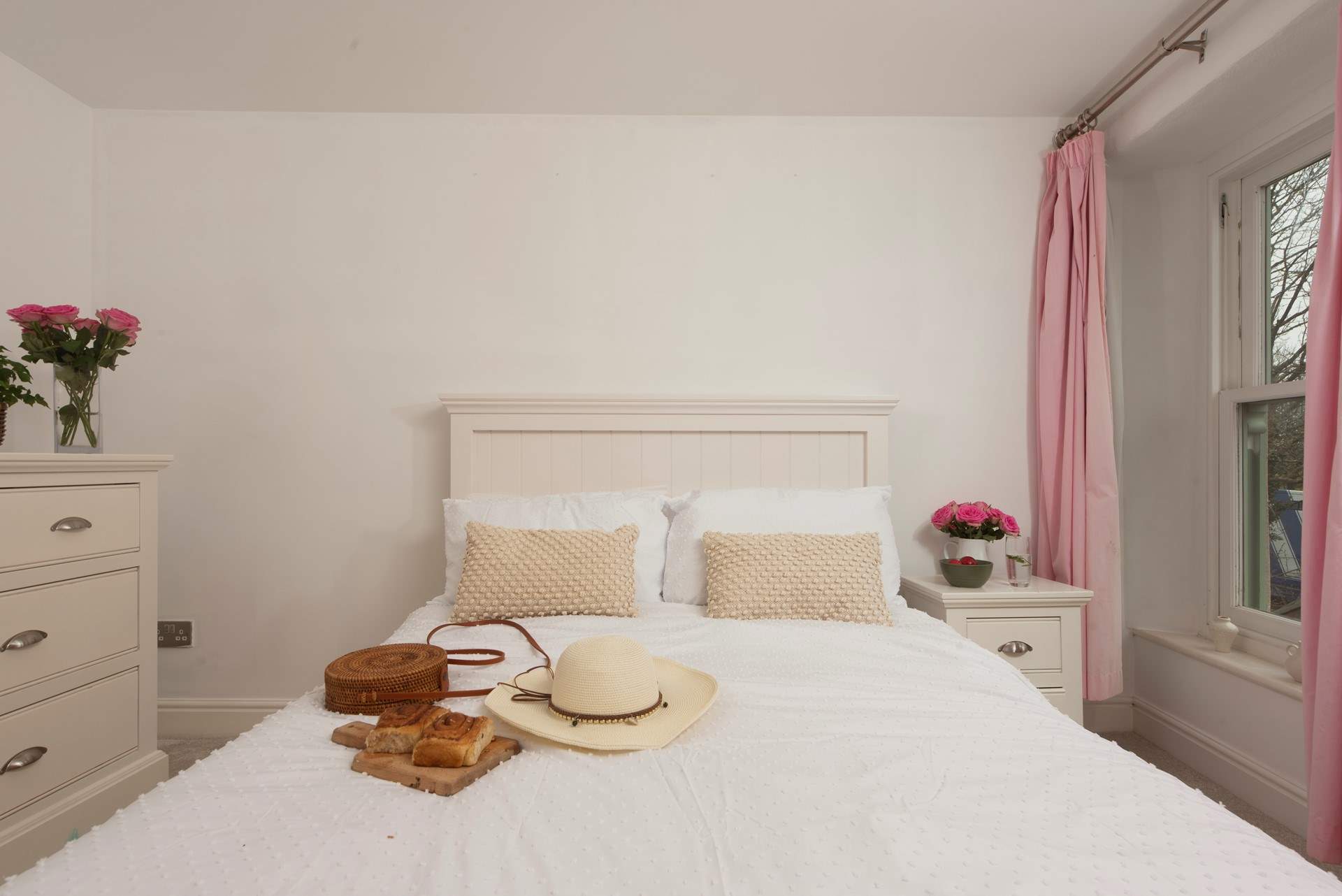 The smaller double is a serene sanctuary for a restful night's sleep.