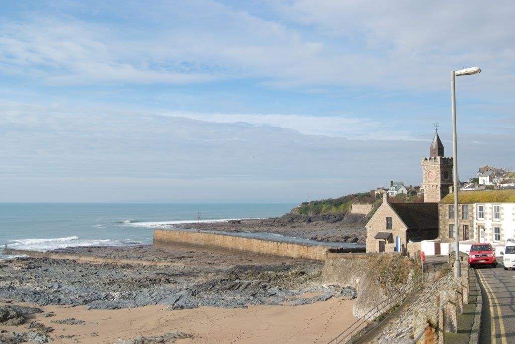 The harbour wall at Porthleven on a calm day.