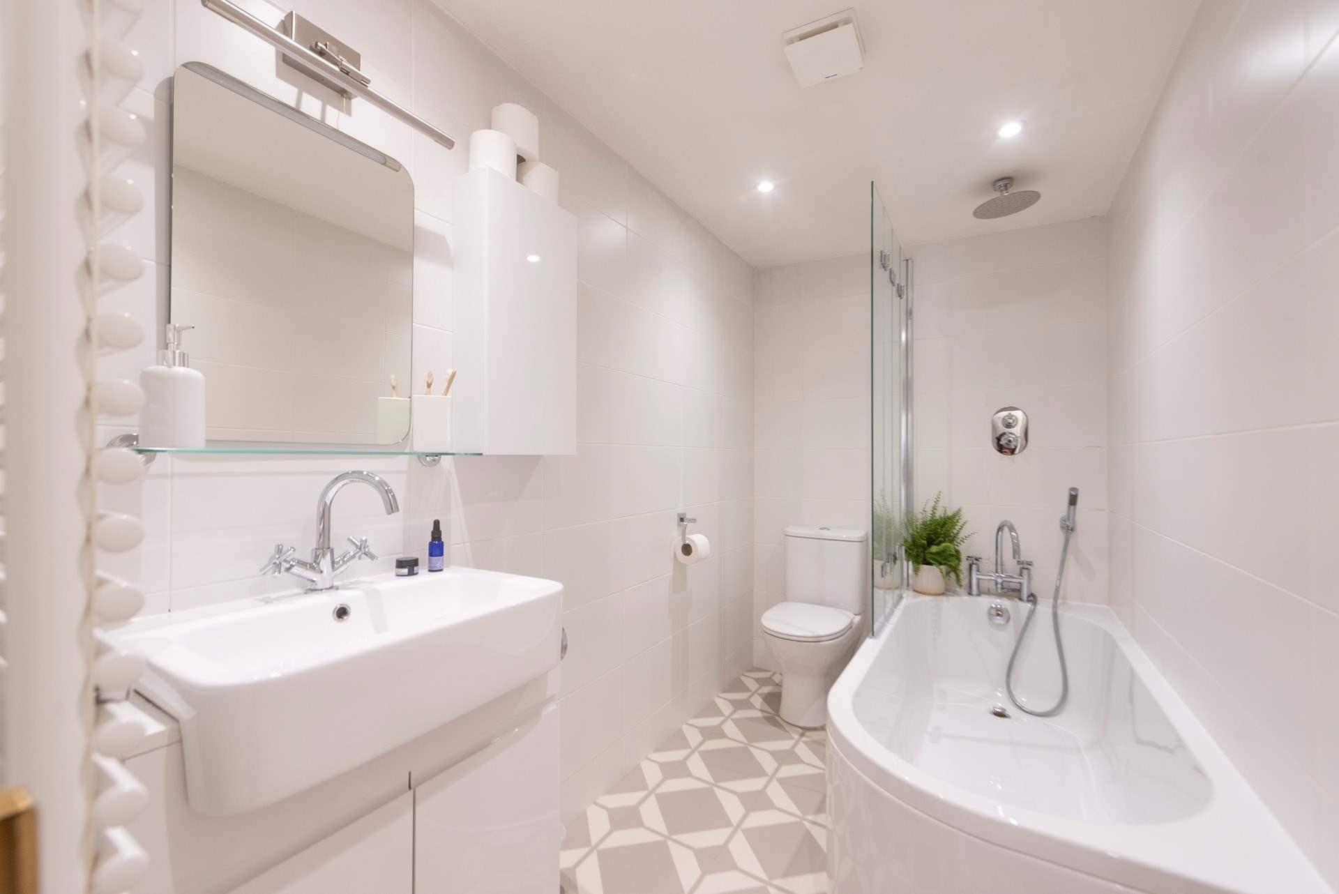 One step up leads you into the modern bathroom. 