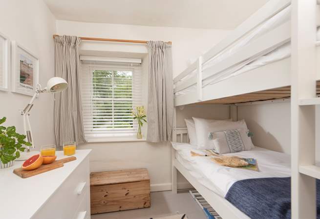 Bedroom 3 is light and bright with bunk-beds (3'). 