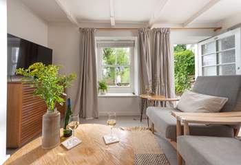 Make yourself at home in the stylish sitting-room. 