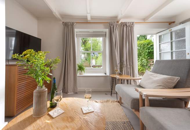 Make yourself at home in the stylish sitting-room. 