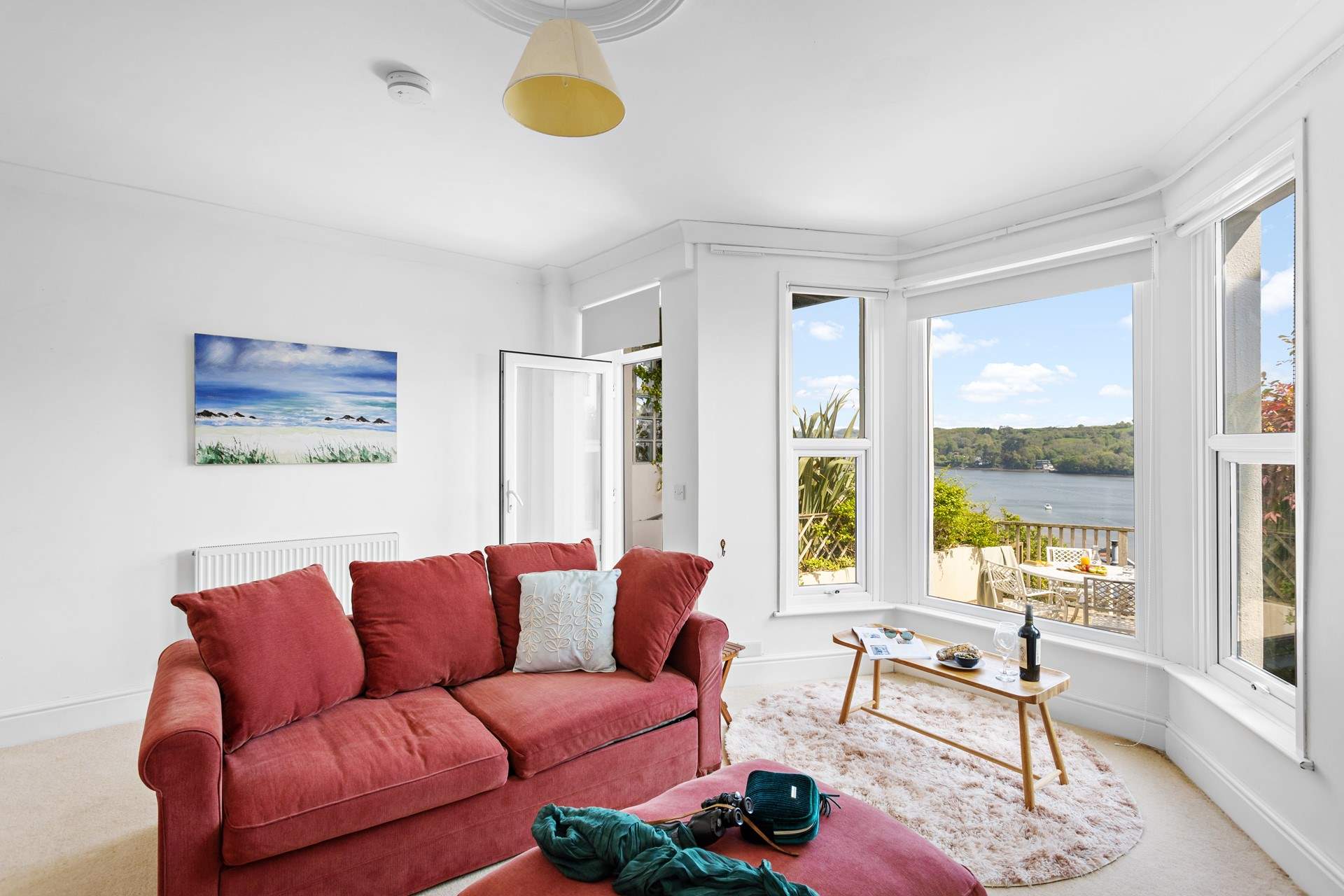 The large bay window perfectly frames the view.