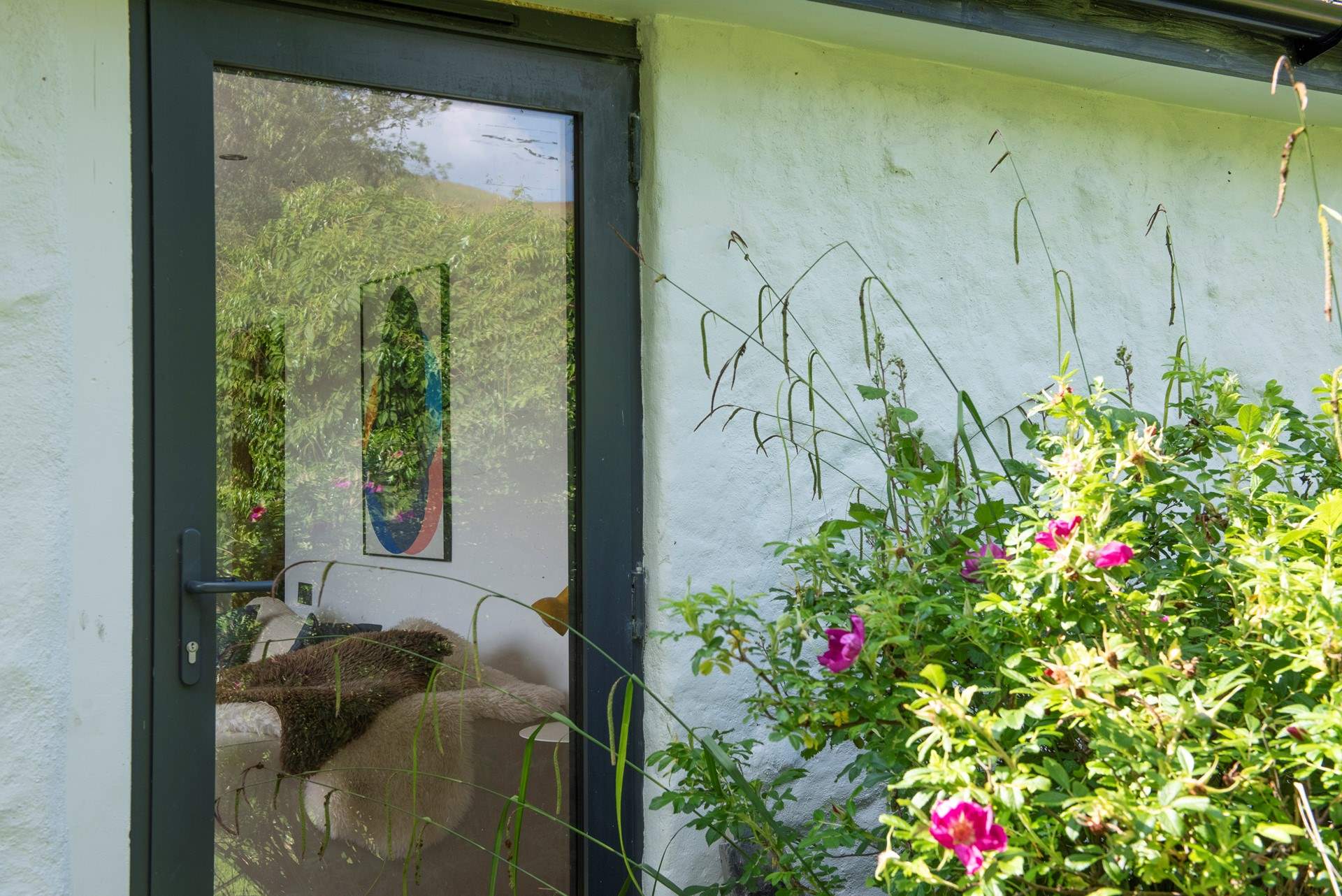 The pretty garden wraps around Tidal Waters.