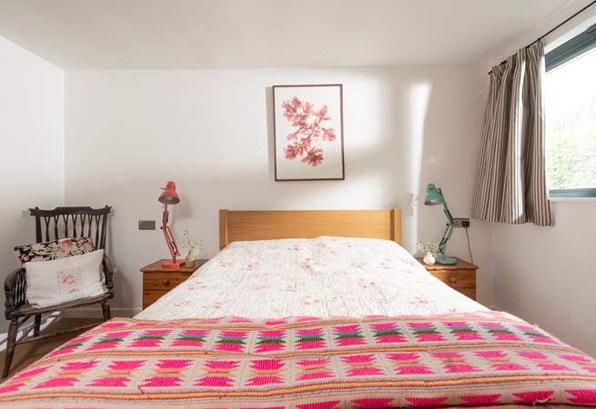 Brightly patterned linens dress the bed in the second bedroom.