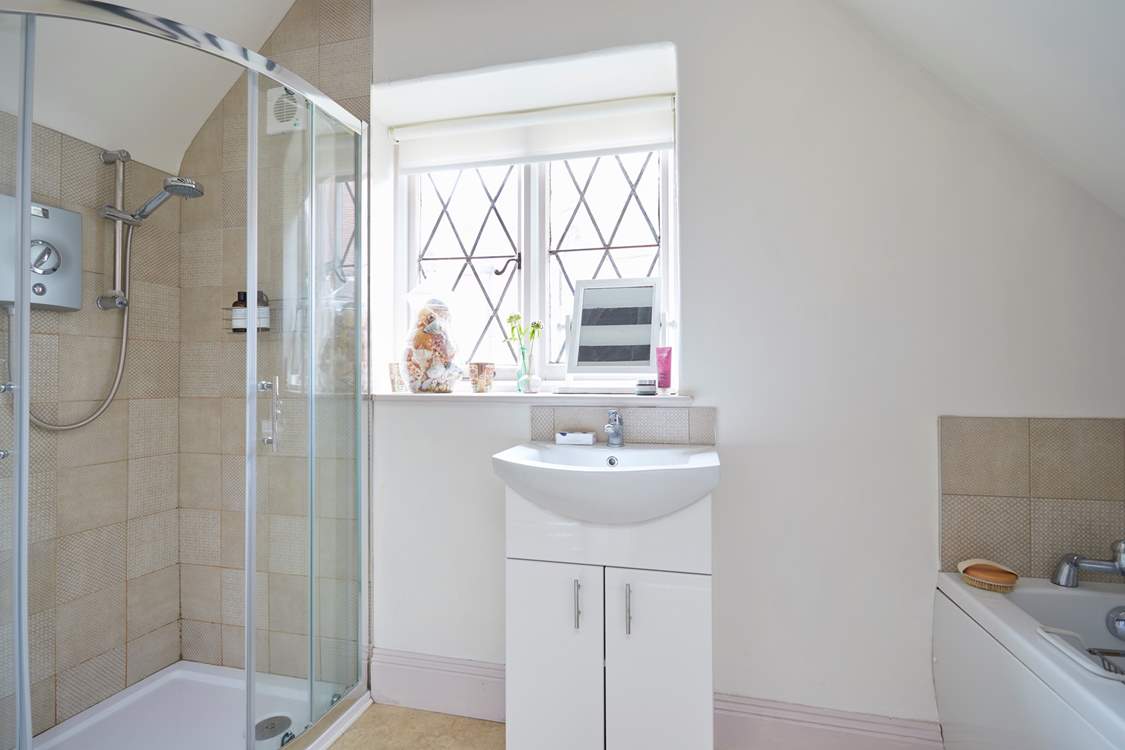 The first floor bathroom has a separate shower cubicle as well as a bath.