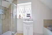 The first floor bathroom has a separate shower cubicle as well as a bath.