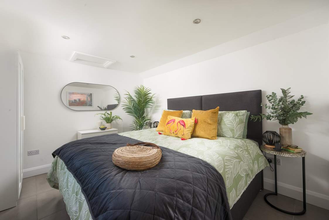 The lovely principal bedroom has oodles of character.