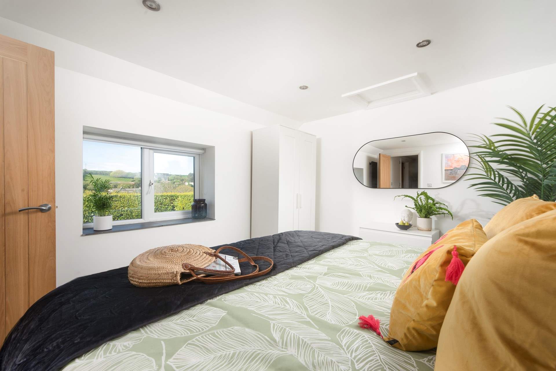 The principal bedroom has views out over the valley. 