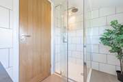 It has a lovely shower cubicle.