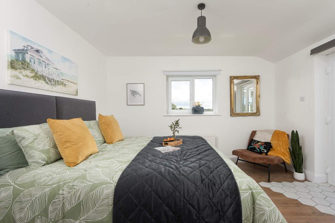This second bedroom has double doors that opens to the terrace.