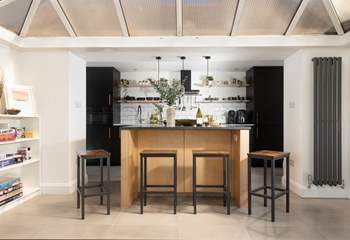 Take a pew at the island for your meals, what a sociable space. 