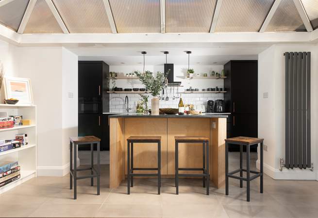 Take a pew at the island for your meals, what a sociable space. 