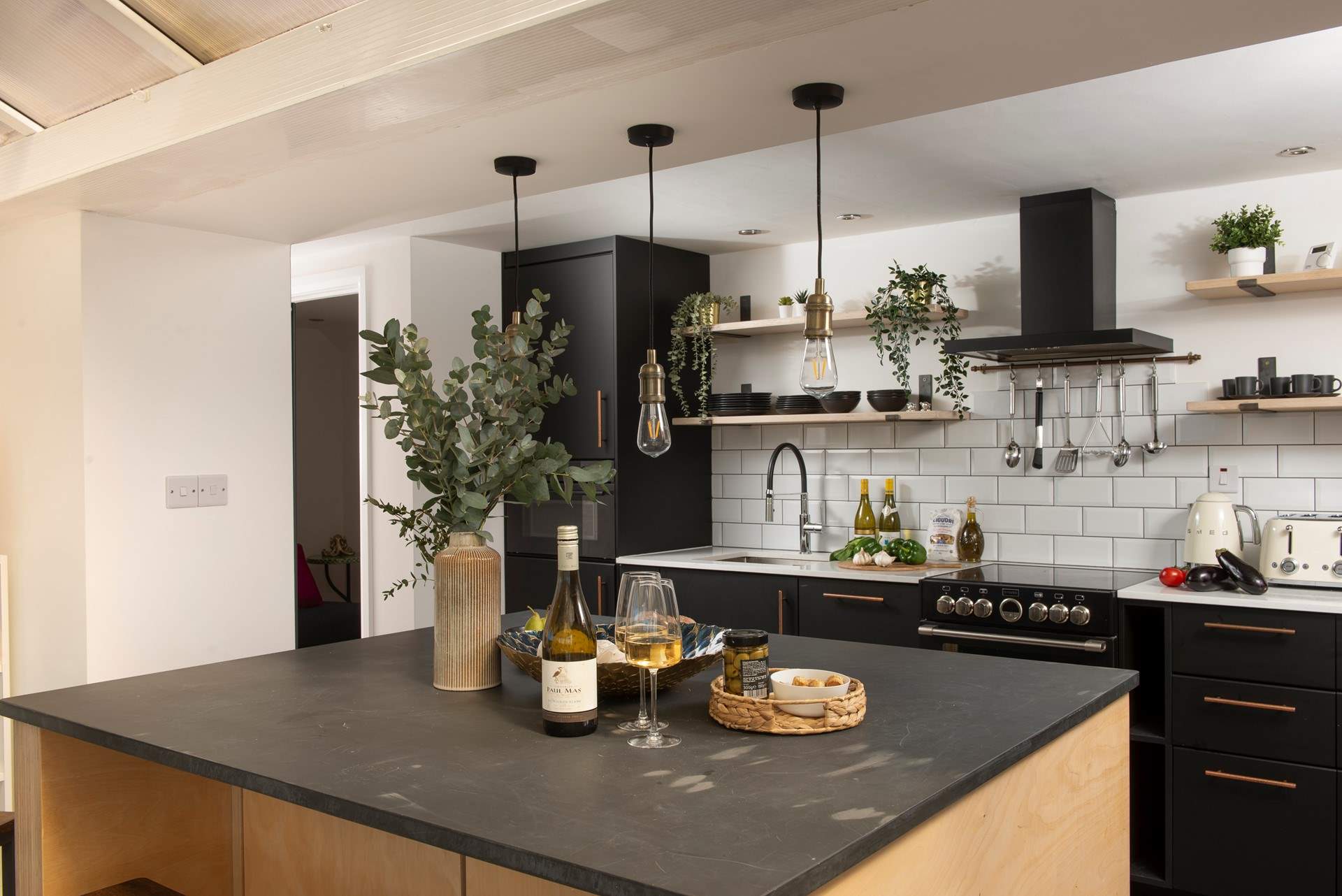 The modern kitchen is very well-equipped. 