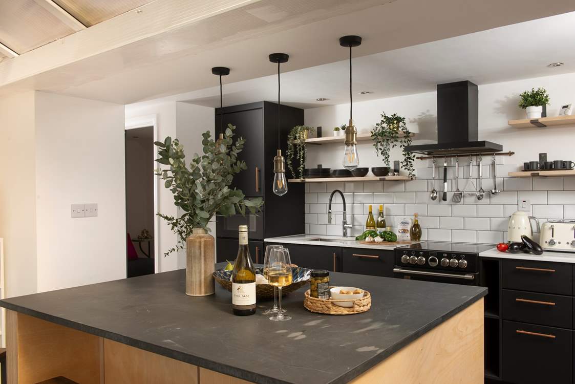 The modern kitchen is very well-equipped.