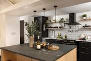 The modern kitchen is very well-equipped.