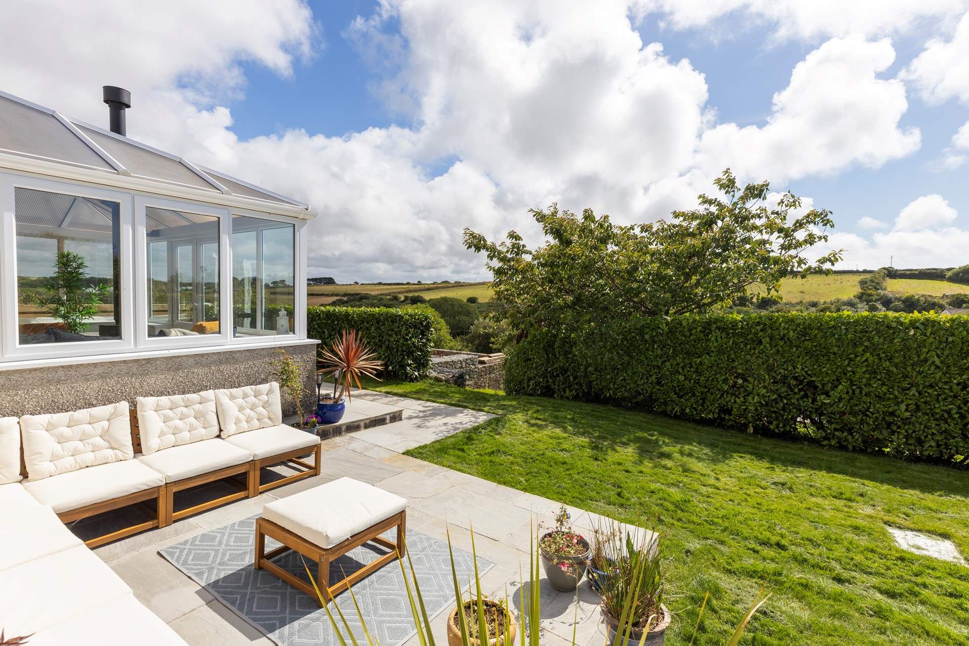 Take a walk though the gap in the hedge to enjoy exploring the shared garden beyond. 