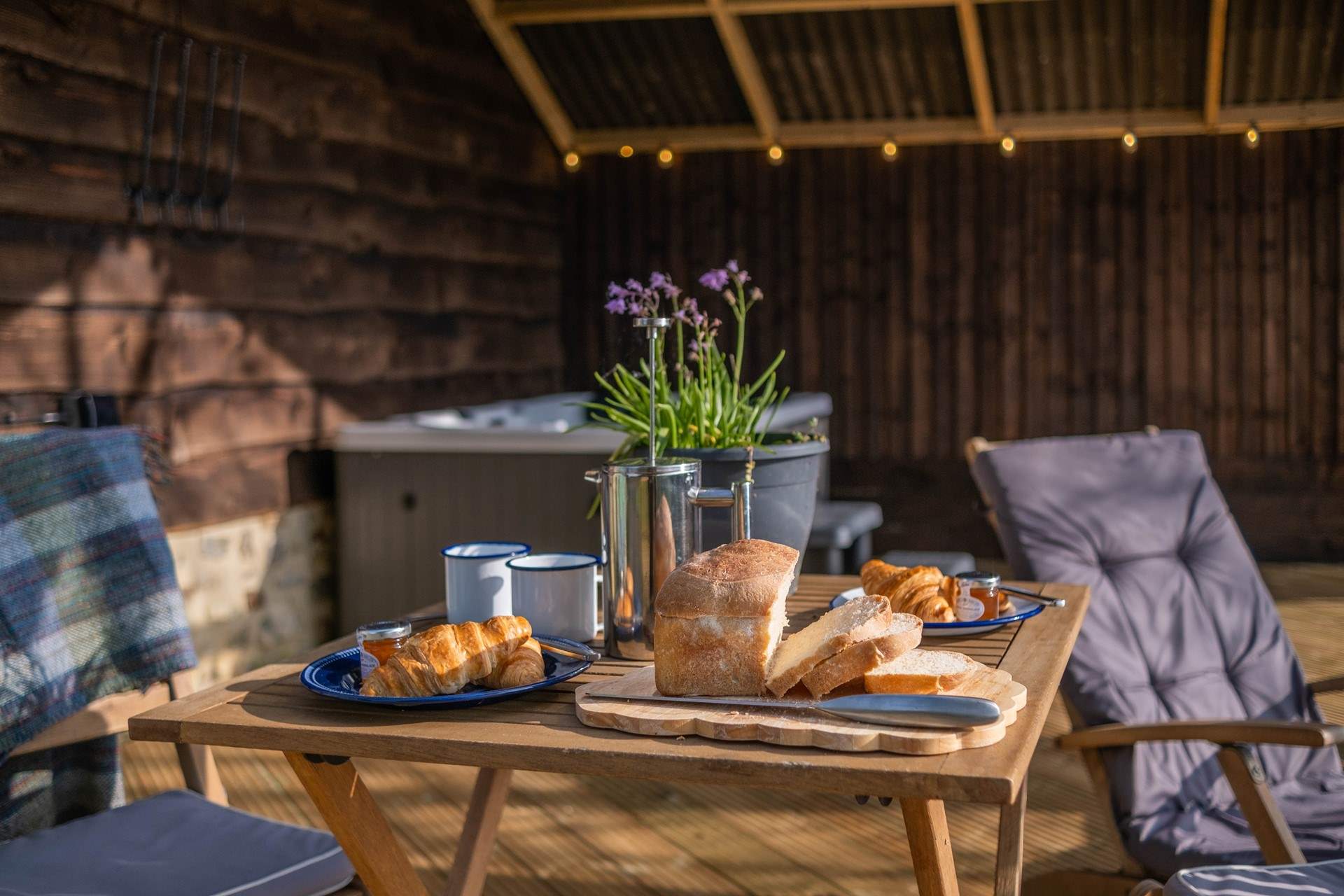 Enjoy breakfast (and freshly baked bread by the owner) in the dappled sunlight while listening to morning birdsong. 