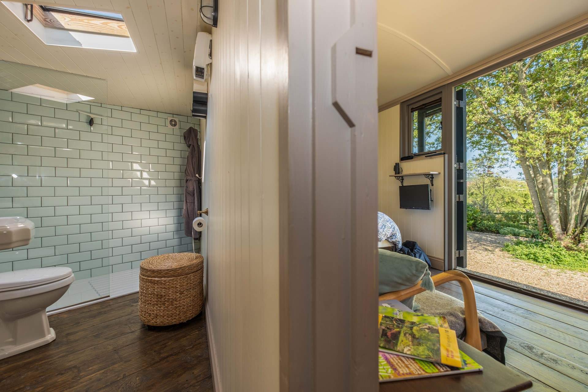 The luxurious en suite shower-room runs adjacent to the living space.