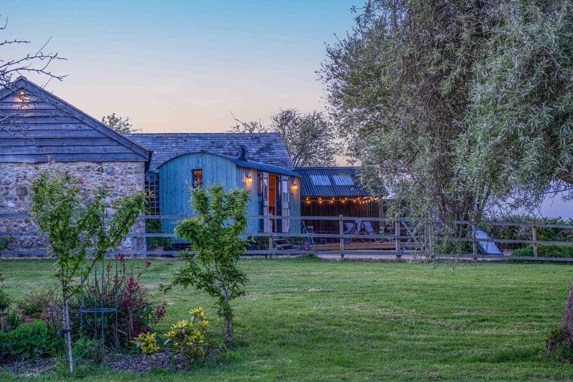As dusk falls the setting becomes even more enchanting. (Please note the traditional buildings behind the hut are used for storage, they are not accommodation.)