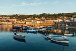 Lovely Mousehole and its quaint cobbled streets and picturesque harbour are close by. 