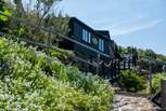 The Surf Shack is nestled into the cliffs above spellbinding Sennen. 