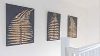 The house has been styled beautifully with the artistic owners adding their own art to the walls.
