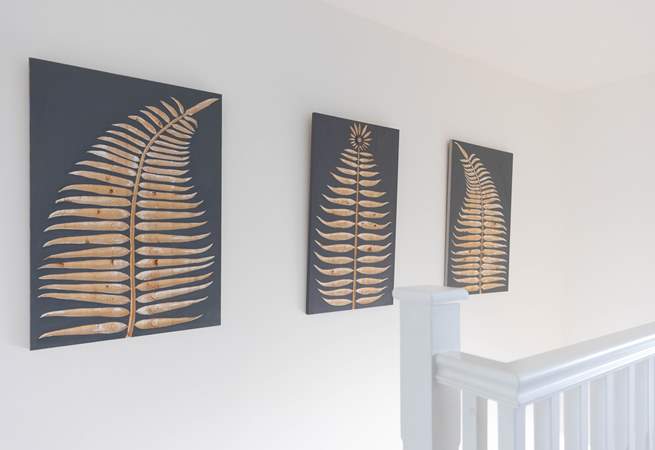 The house has been styled beautifully with the artistic owners adding their own art to the walls.