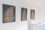 The house has been styled beautifully with the artistic owners adding their own art to the walls.
