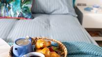 A comfy bed awaits with fresh linens and gorgeous towels. 
