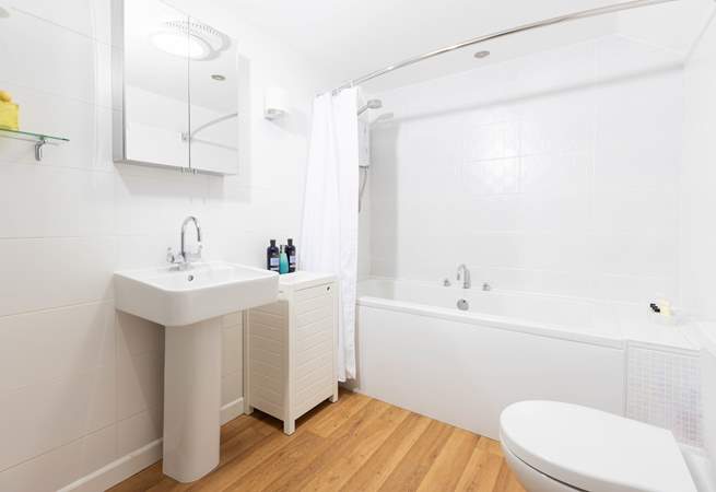 The family bathroom sits between both bedrooms on the landing. 