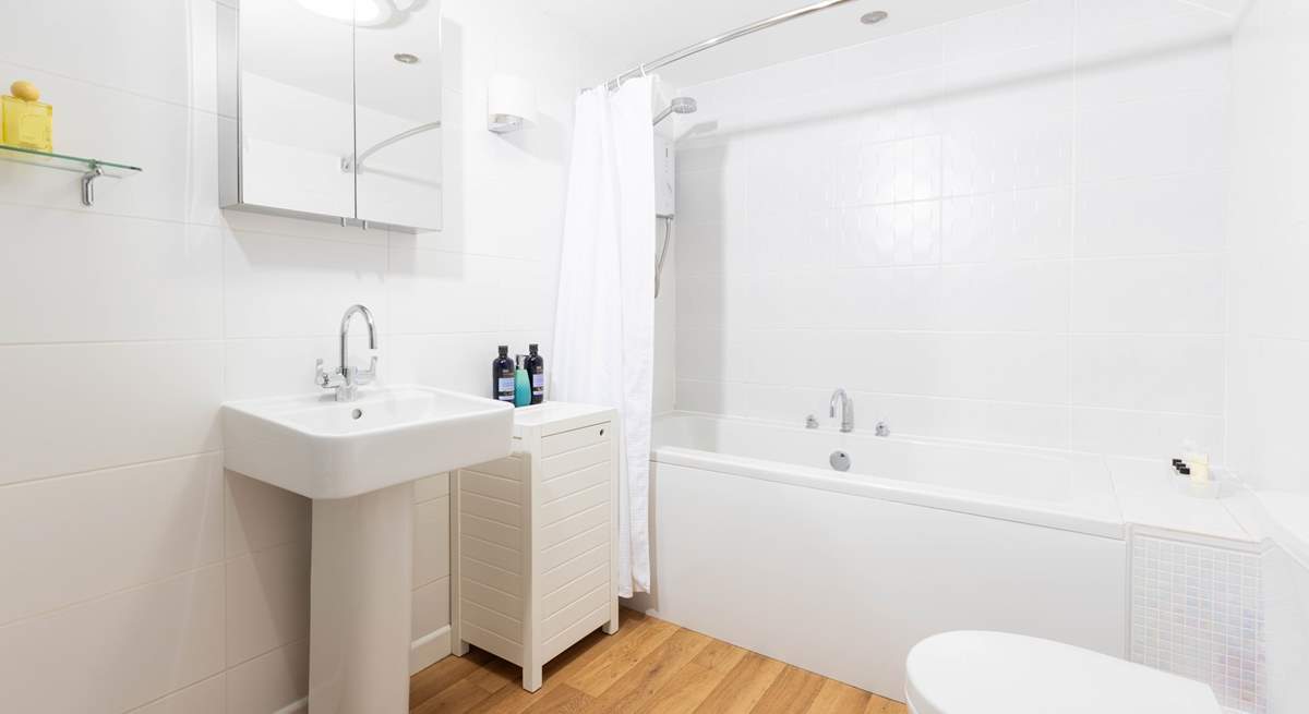 The family bathroom sits between both bedrooms on the landing. 