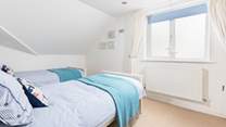 The perfectly formed twin bedroom sits to the back of the house. 