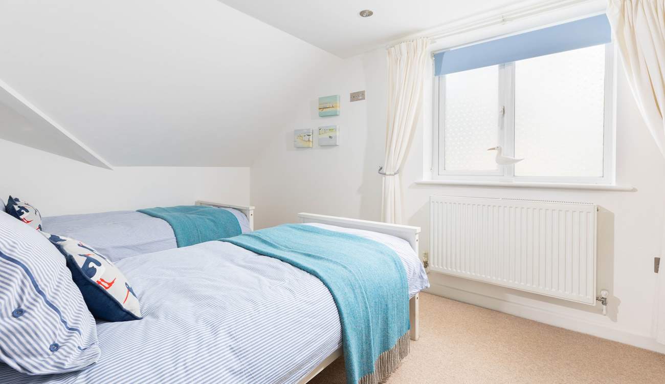 The perfectly formed twin bedroom sits to the back of the house. 