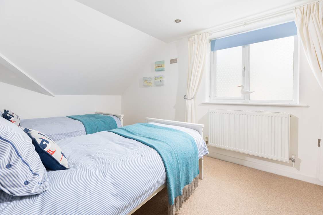 The perfectly formed twin bedroom sits to the back of the house.