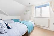 The perfectly formed twin bedroom sits to the back of the house.