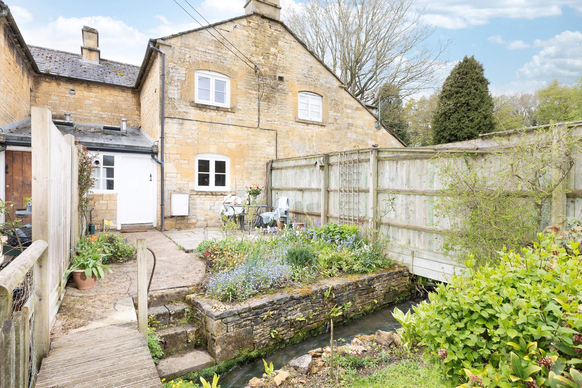 This tranquil cottage garden has a delightful babbling stream.