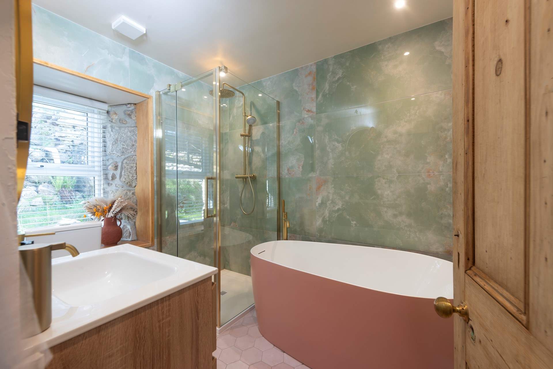 Marble clad bathroom, with a free-standing bath big enough for two.
