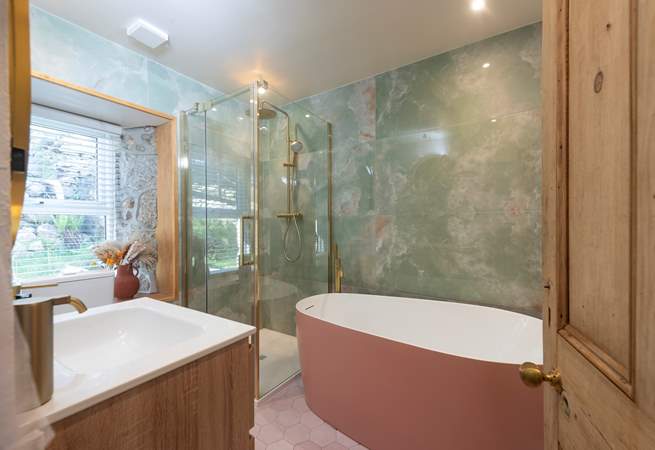 Marble clad bathroom, with a free-standing bath big enough for two. This one is downstairs.